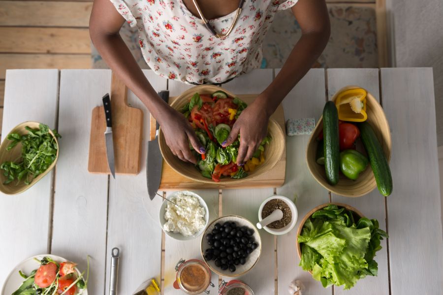 overhead shot of woman making a fresh salad